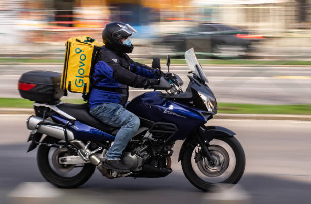 Food delivery courier - state of emergency due to coronavirus - Bucharest, Romania stock photo
