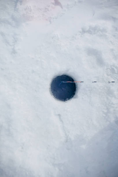istock ice fishing hole 1215243507