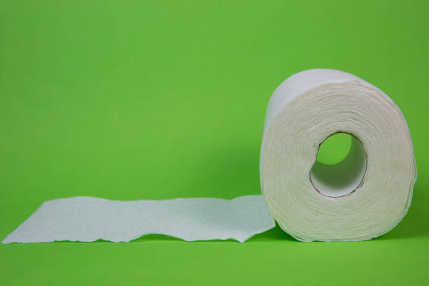 istock Toilet Paper on a Green Background 1215245986