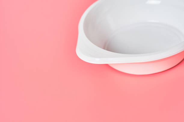 istock Disposable plastic bowl on pink background. Concept of save environment, ecology, recreation on picnic, party and other events. Copy space 1215246711