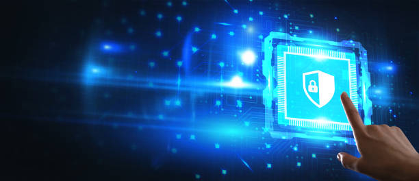istock Business, technology, internet and networking concept. Young businessman working in the office, select the icon security on the virtual display. 1215246759