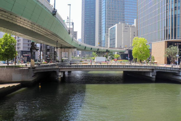 istock Highway passing over the river in Osaka City 1215247529