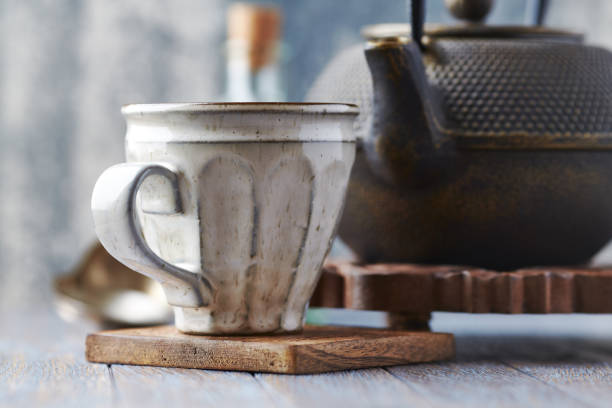 istock Tea culture. Traditional, handcrafted ceramic on stone background. 1215247664