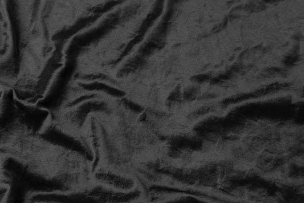 istock Abstract black fabric cloth texture background or liquid wave or wavy folds 1215252951