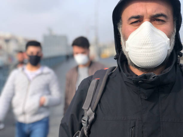 istock Man wearing face mask to protect himself. 1215253830