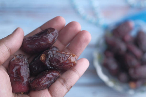 istock top view of date fruit on man hand 1215256938