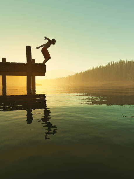istock Jumping into the lake from a pontoon during sunset . This is a 3d render illustration . 1215261664