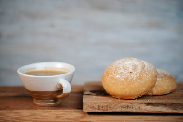istock homemade breakfast: homemade whole wheat bun and coffee 1215264130