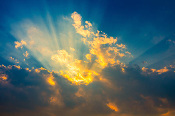 istock blue sky with clouds in the evening with sunbeam 1215267827