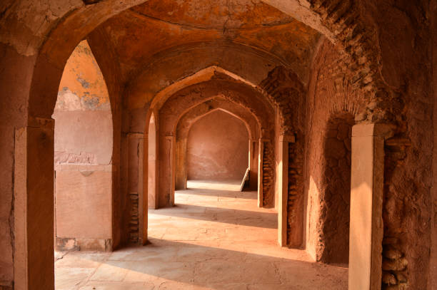 istock A mesmerizing view with sun rays create dramatic light and shadow of inside the hall of safdarjung tomb memorial from the main gate,entrance at winter morning. 1215269825