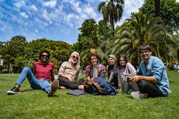 istock Professor lecturing to students in park 1215274241