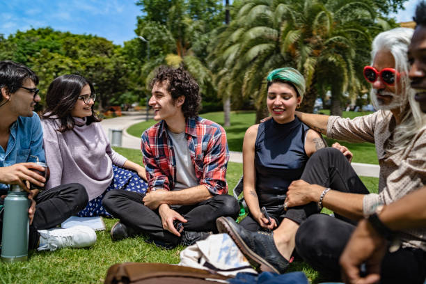 istock Professor lecturing to students in park 1215274265