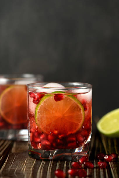 istock Pomegranate Gimlet - a gin based cocktail with lime juice, gin can be replaced with vodka. 1215275464