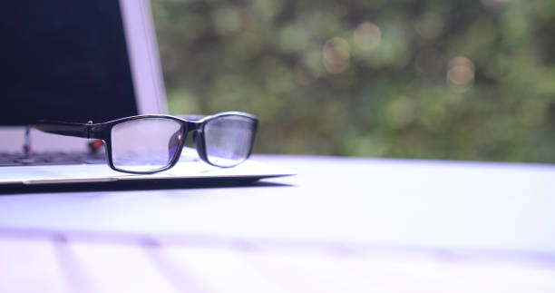 istock Reading glasses on top of computer laptop. Copy space. 1215277451