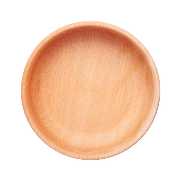 istock Wooden bowl isolated on white background. Top view of empty dishware with space for text. Handcrafted cooking utensil 1215277642