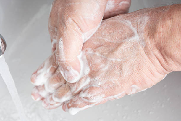 istock A man washing his hands 1215279585