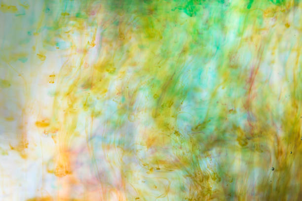 istock Abstract yellow and green background, ink in the water. 1215283382