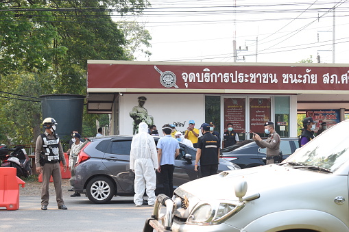 Checkpoint & medical station on the road near to police station with staff wearing face masks amid Covid-19 coronavirus epidemic at Si Bun Rueang District, Nong Bua Lam Phu Province, Thailand - March 28, 2020