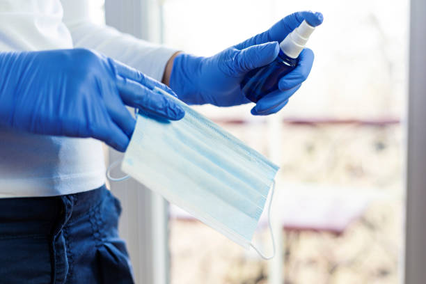 istock Protective facial mask and disinfectant, close up 1215289906