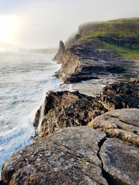 istock Faroe Islands Coast with rough Sea 1215290518