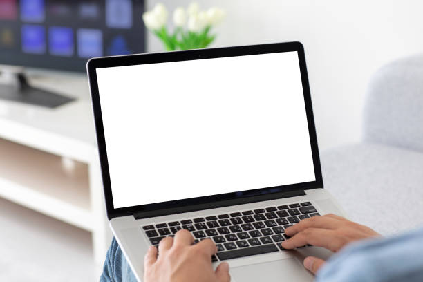 istock male hands on keyboard laptop with isolated screen in room 1215290563