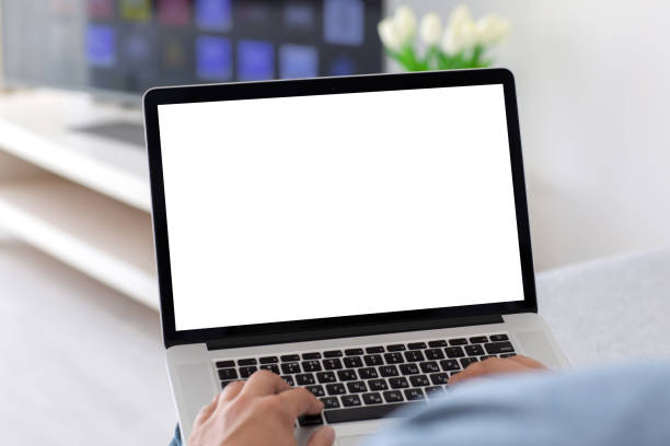 istock male hands on keyboard laptop with isolated screen in room 1215290861