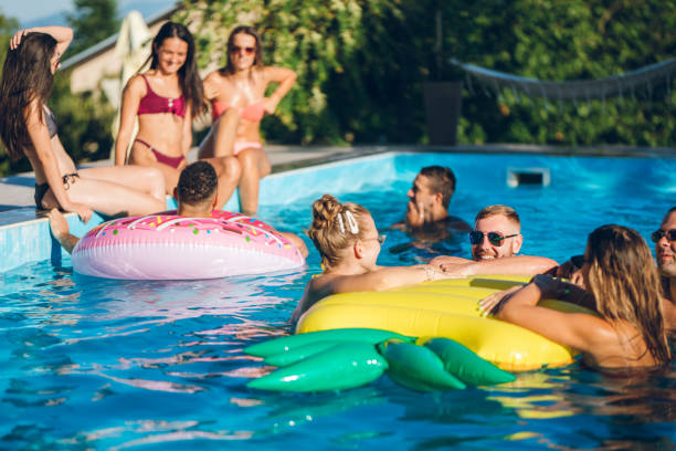 istock Friends at a poolside party 1215293576