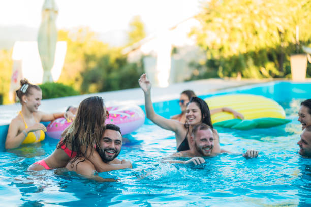 istock Friends at a poolside party 1215293981