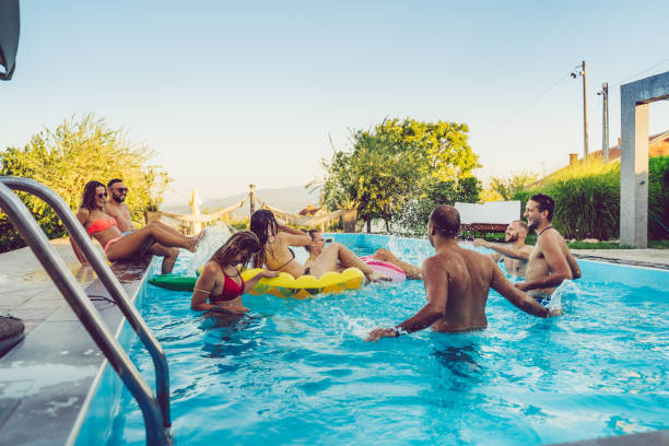 istock Friends at a poolside party 1215294011