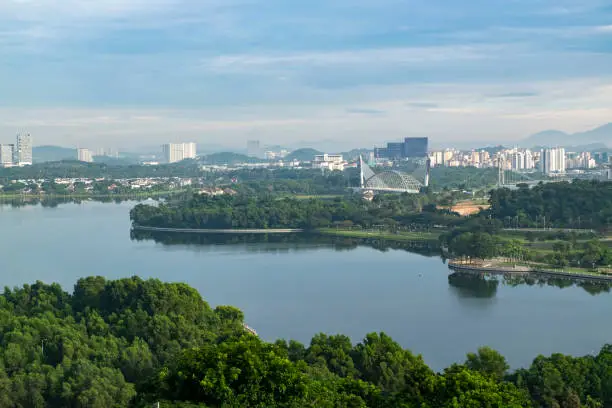 Photo of Beautiful scenery Putrajaya city surrounding by lake over cloudy sky background