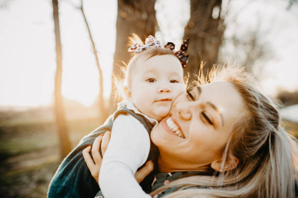 istock Single mum and her child in the park 1215296407