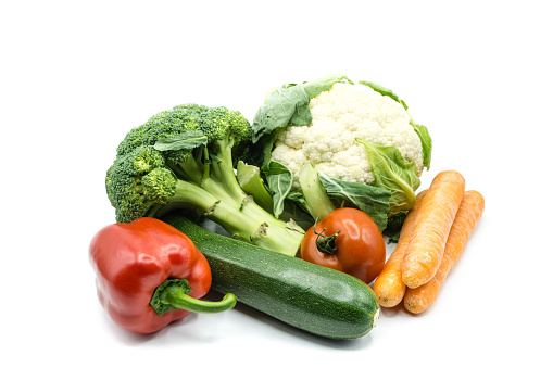 Various vegetables zucchini paprika cauliflower broccoli isolated on white background
