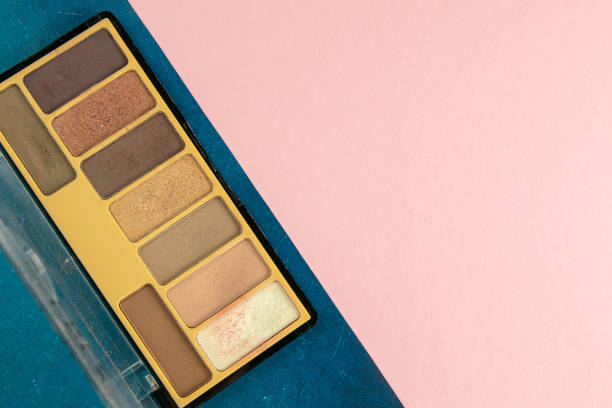 istock Colorful shades for make-up stand on a pink table. Top views 1215300190