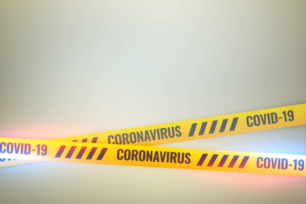 istock coronavirus covid-19 do not cross yellow tape background 1215301939