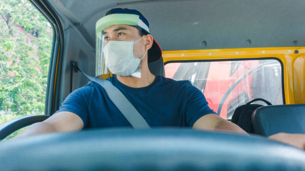 istock Truck driver wearing a mask 1215302044