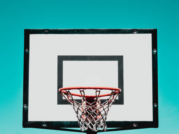 istock Basketball hoop on green background 1215303379