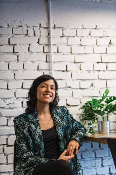 istock Smiling satisfied with the environment at her work place 1215304641