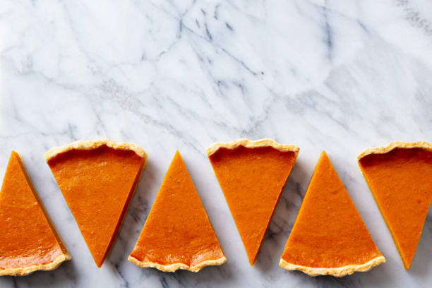 istock Pumpkin pie pieces. Marble background. Copy space. Top view. 1215304805
