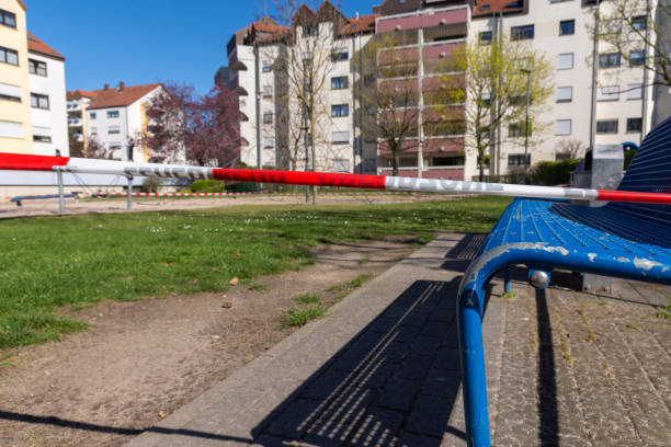 istock a restricted zone due to the coronoa virus on a playground with benches 1215305920