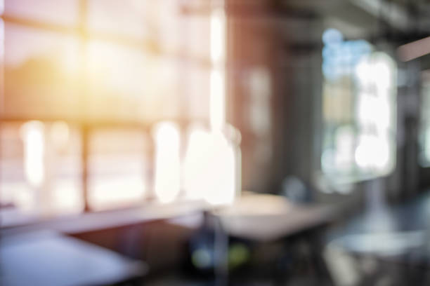 istock Blurred interior of modern office workplace a workspace design 1215306211
