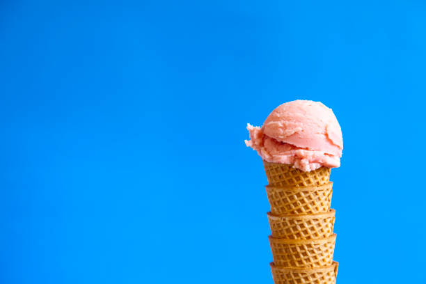 istock strawberry ice cream ball on waffle cornet 1215307228