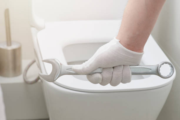 istock Plumber hand with wrench 1215308787