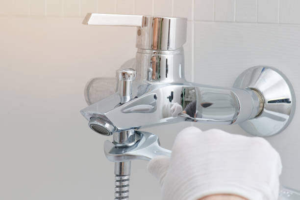 istock Fixing faucet in bathroom 1215308794