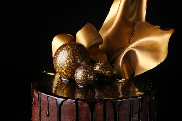 istock Fancy chocolate cake, isolated, black background. Close up. 1215309120