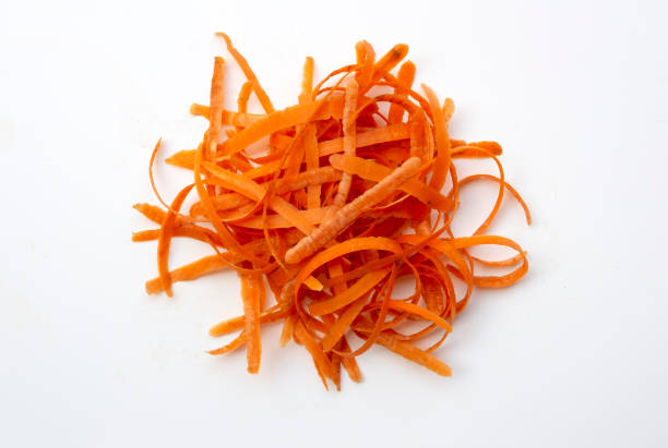 istock Bunch of carrot peel on white 1215309274