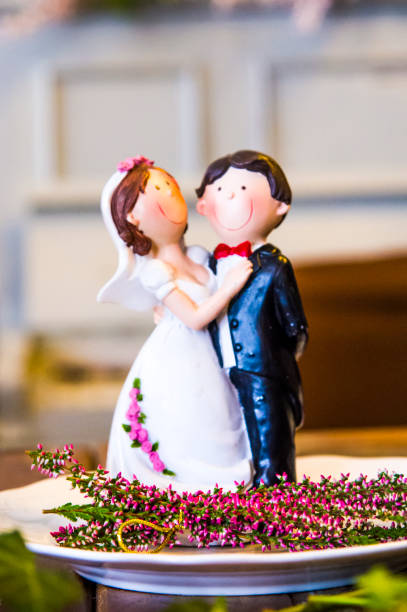 istock delicious wedding cake, small statuettes 1215311193