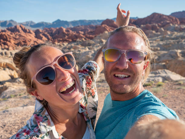 istock Couple taking selfie in valley of fire state park 1215311595
