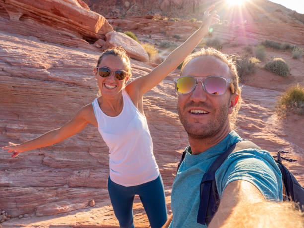 istock Couple taking selfie in valley of fire state park 1215312910