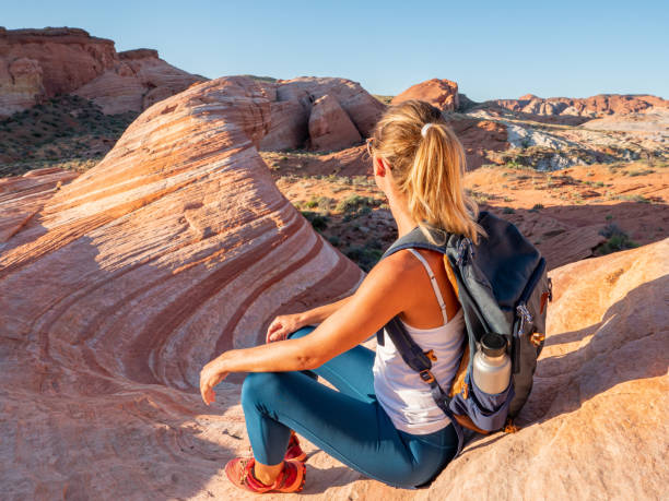 istock Hiker woman contemplating red sandstone 1215312949