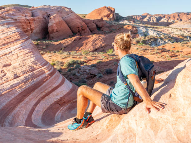 istock Hiker man contemplating red sandstone 1215313709